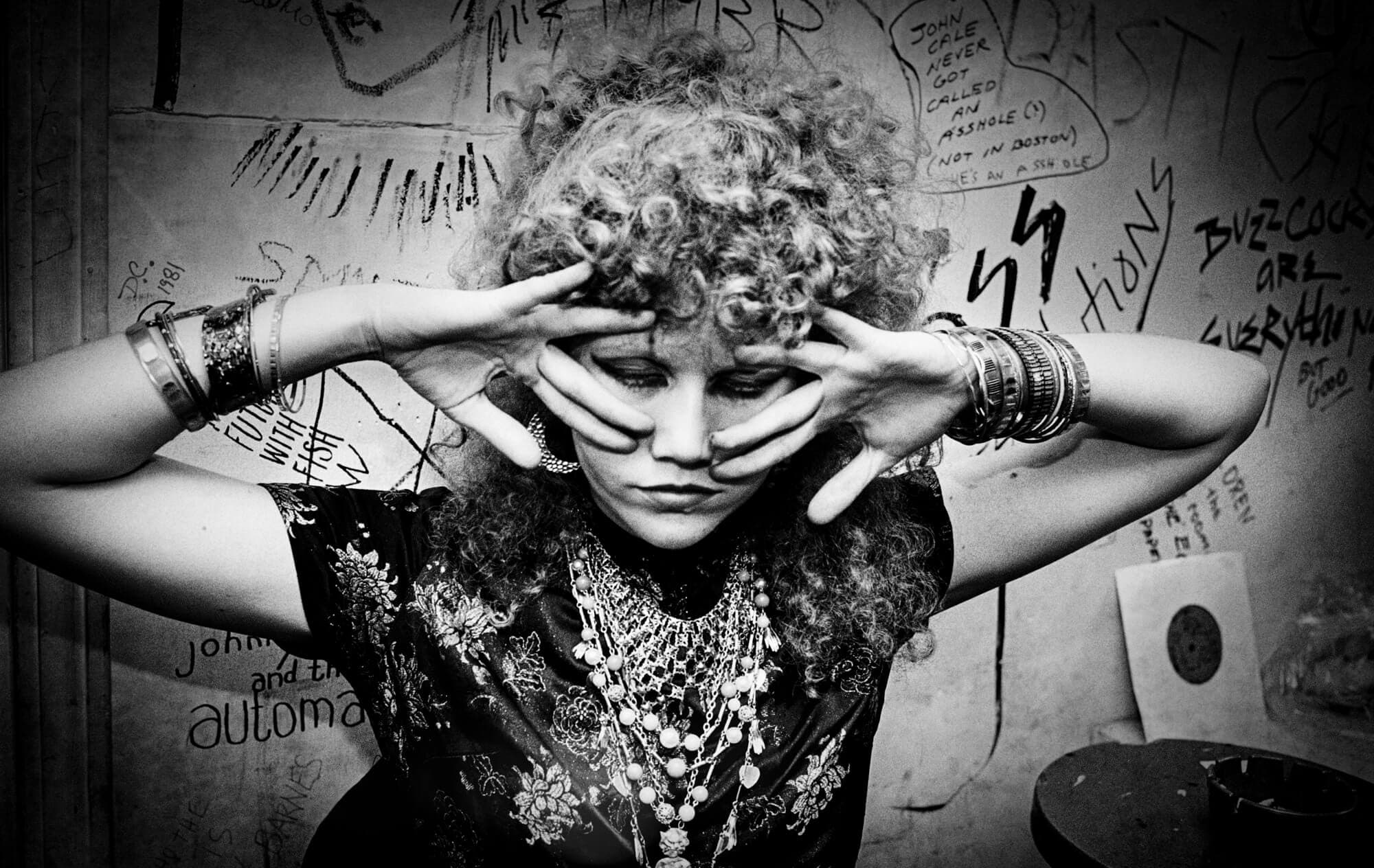 Lead guitarist Poison Ivy (born Kristy Marlana Wallace) of the punk rock band "The Cramps" is backstage before performing at a theater in 1980 in Boston, Massachusetts.